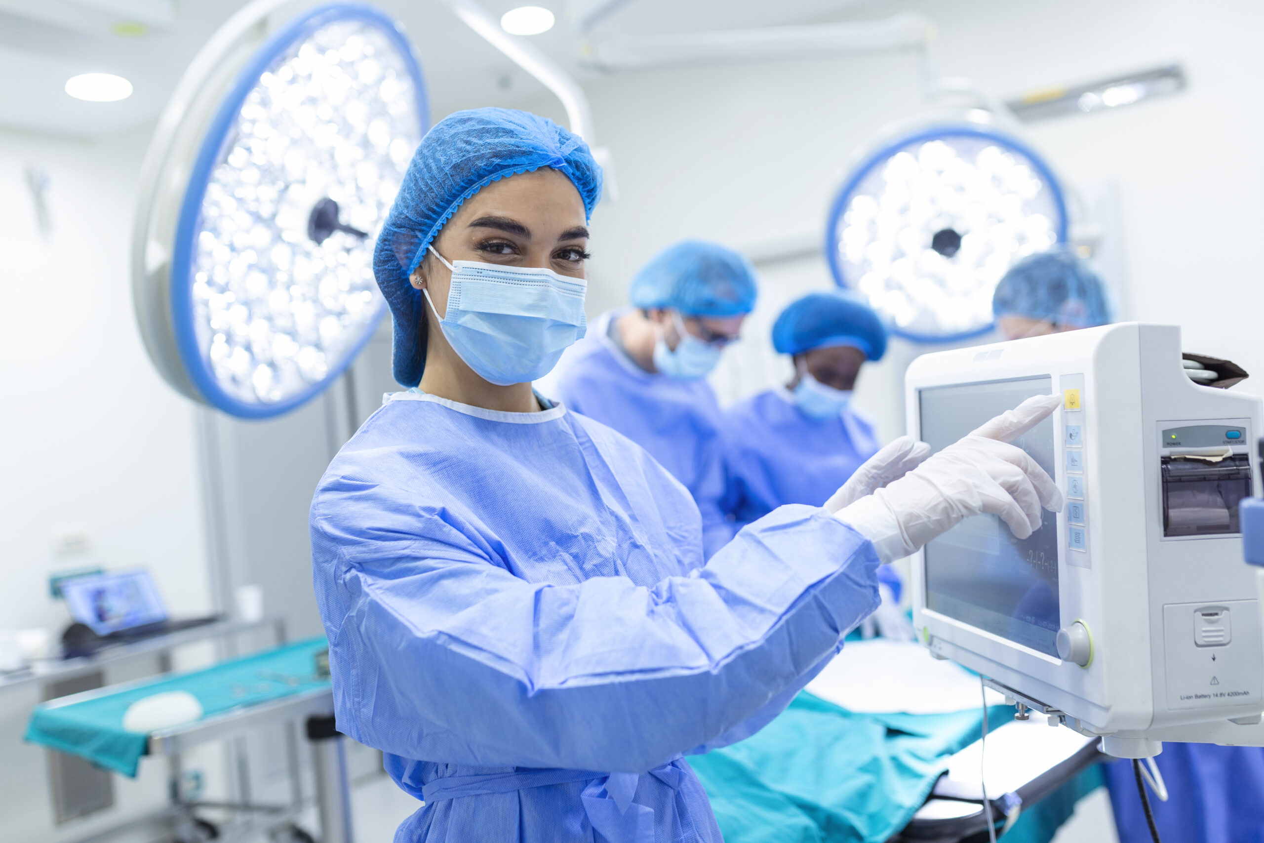 anesthesiologist-keeping-track-vital-functions-body-cardiac-surgery-surgeon-looking-medical-monitor-surgery-doctor-checking-monitor-patient-health-status-scaled.jpg